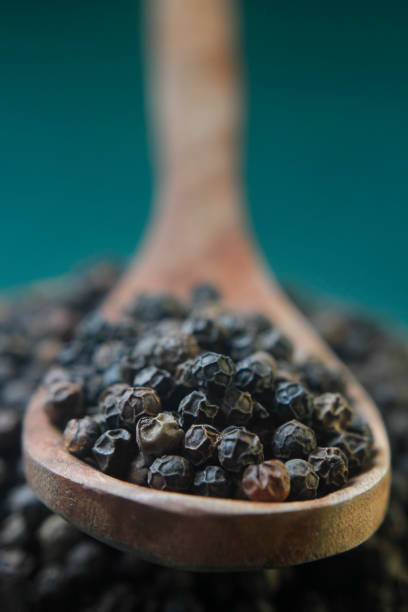 istock Close-Up Of Black Pepper In Spoon 1084995444