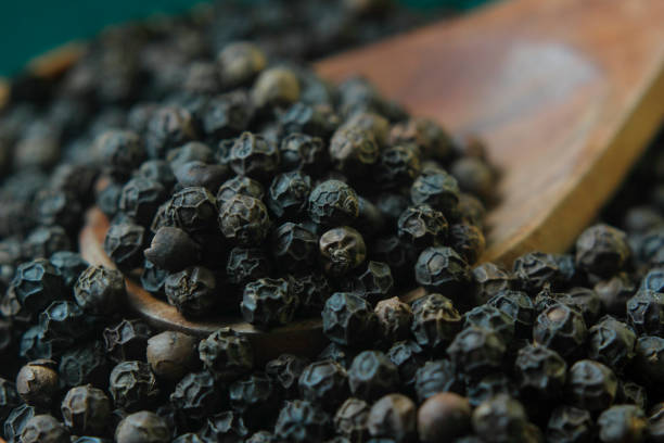 istock Close-Up Of Black Pepper In Spoon 1084995606
