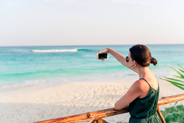 istock Beautiful woman outdoors at tropical exotic vacation 1084995996