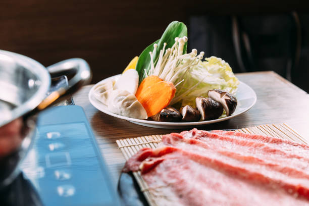 istock Shabu vegetables set including cabbage, false pak choi, carrot, shiitake, enokitake and gyoza. 1084996432