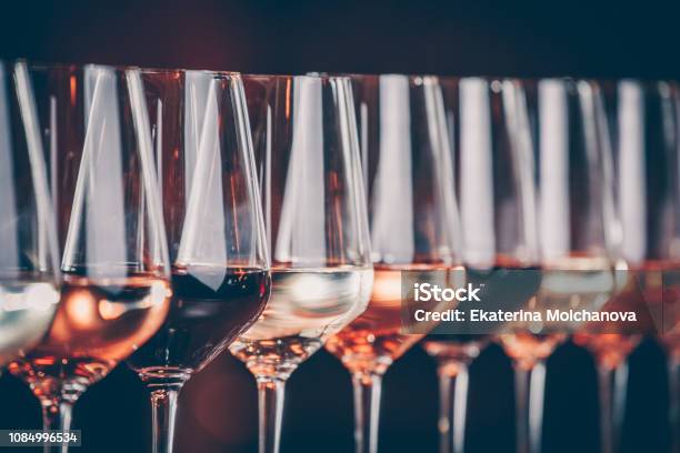Wine Glasses In A Row Buffet Table Celebration Of Wine Tasting Nightlife Celebration And Entertainment Concept Stock Photo - Download Image Now