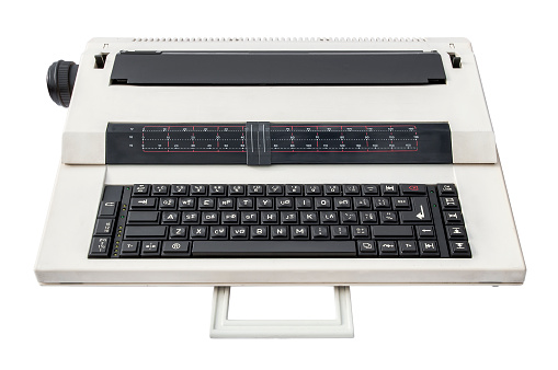 Old electronic typewriter isolated over white background