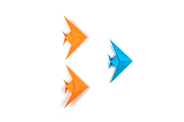 istock Two origami fishes isolated on white background. 1085000246
