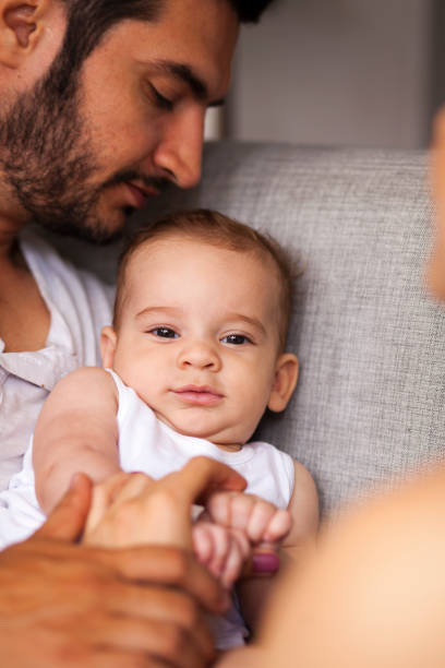 istock Dad kisses his baby 1085003986