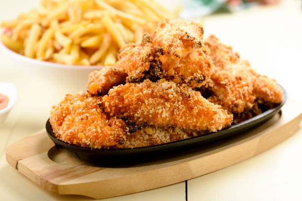 chicken strips and fries chicken strips with fries and sauce nuggets heat stock pictures, royalty-free photos & images