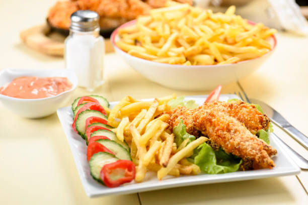 istock chicken strips and fries 1085006254