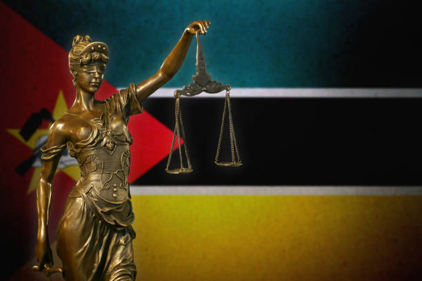 istock Lady Justice before a flag of Mozambique 1085006274
