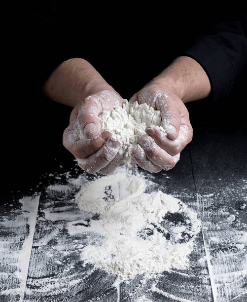 istock white wheat flour in male hands 1085014212
