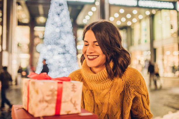 istock Smiling girl taking gifts 1085016338