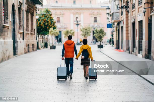 Couple Traveling Around The World Stock Photo - Download Image Now - Travel, Vacations, Suitcase