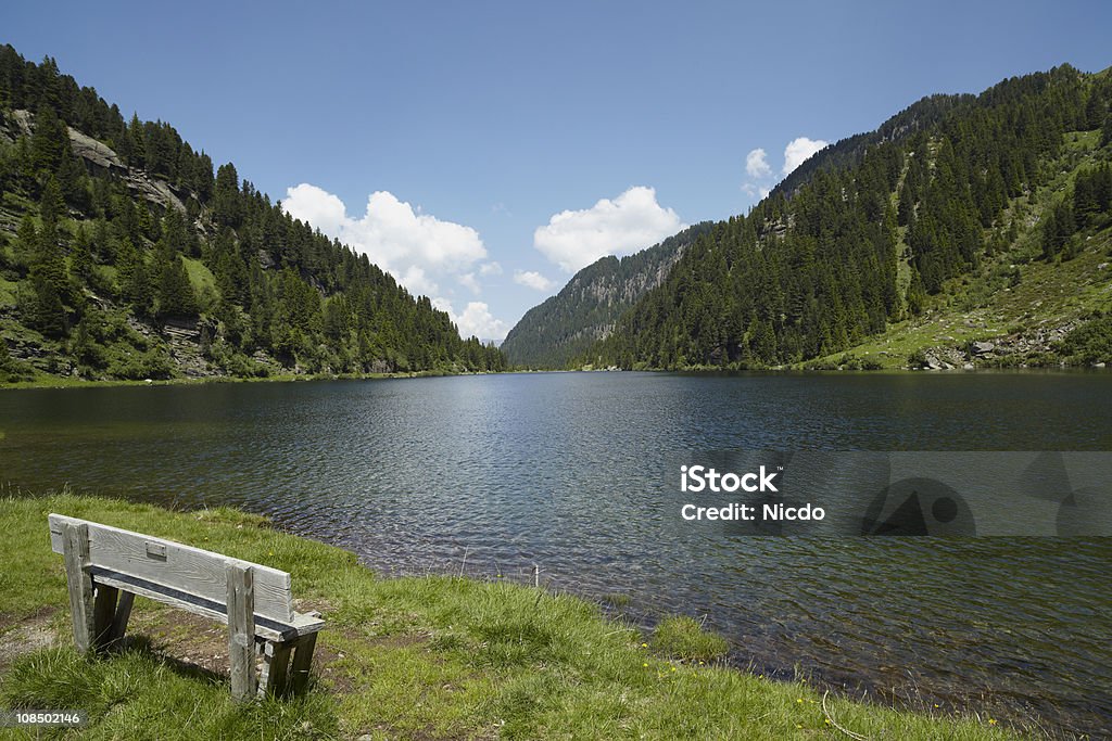 Alpine lake Alpine lake in the Dolomites. Lagorai Bench Stock Photo