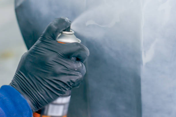 istock paint spray can in the hand of a worker 1085025162