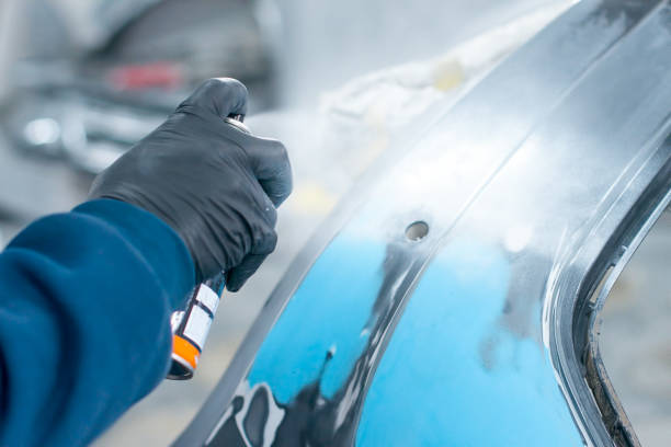 istock paint spray can in the hand of a worker 1085025222