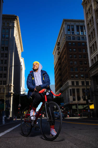 istock Smiling Bike Messenger Pausing Between Deliveries 1085027346
