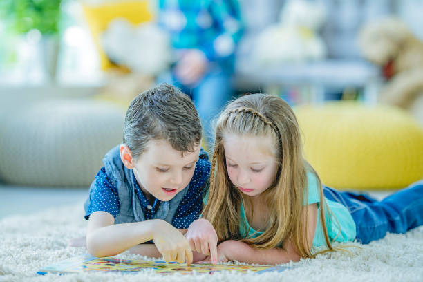 istock Kindergarten kids reading together 1085027352