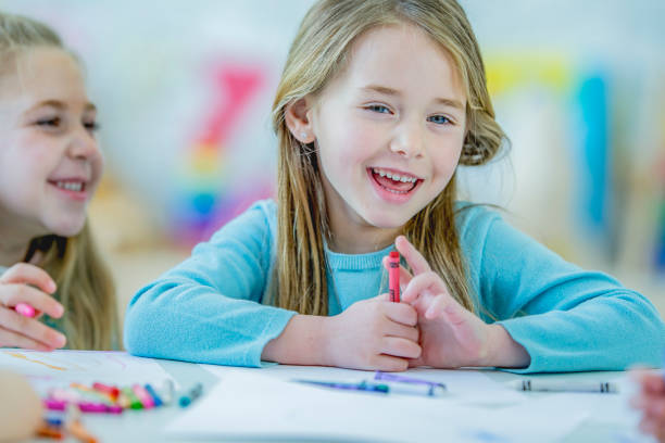 istock Kindergarten girls drawing 1085027360