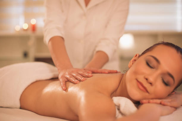 istock Young woman enjoying massage 1085027780