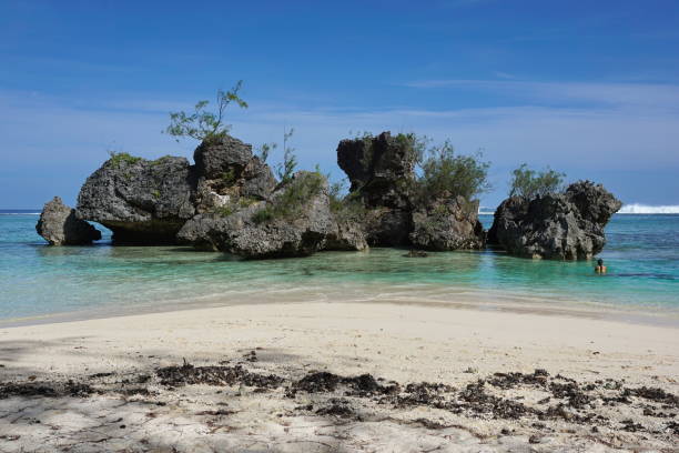 istock Large rocks in the lagoon close to sandy beach 1085032328