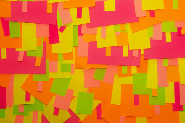 istock Bright multi-colored stickers on the office white board. 1085046394