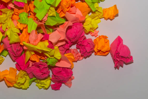 istock Bright crumpled multi-colored stickers on the office white board. 1085046836