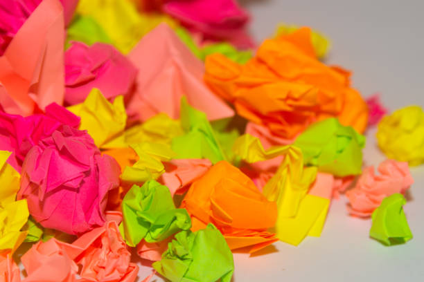 istock Bright crumpled multi-colored stickers on the office white board. 1085046856