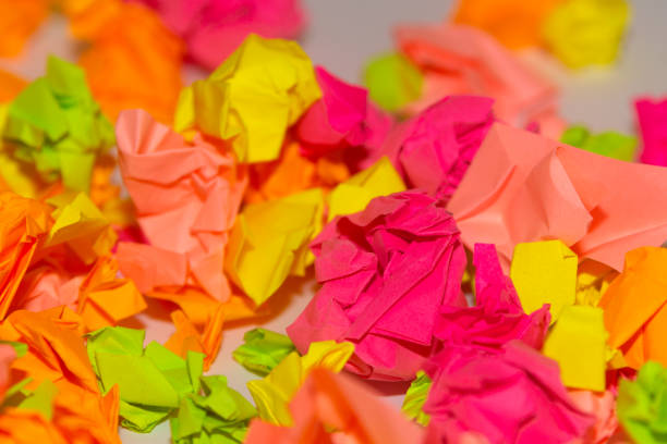 istock Bright crumpled multi-colored stickers on the office white board. 1085046858