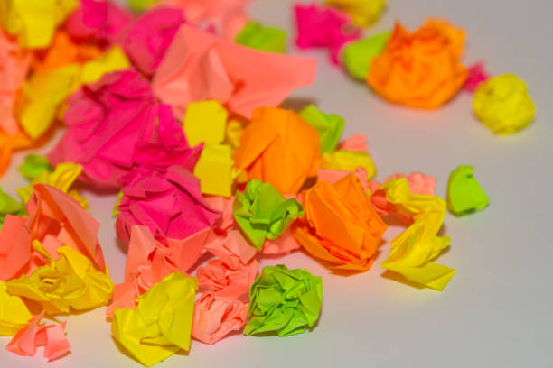 istock Bright crumpled multi-colored stickers on the office white board. 1085046874