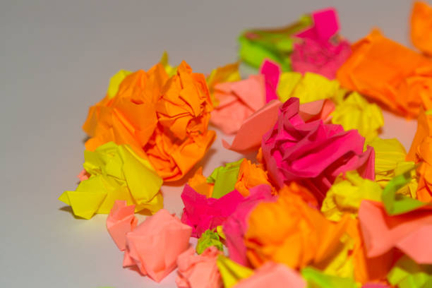 istock Bright crumpled multi-colored stickers on the office white board. 1085046880