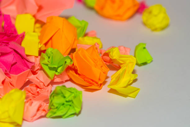 istock Bright crumpled multi-colored stickers on the office white board. 1085046882