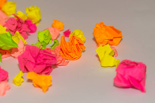 istock Bright crumpled multi-colored stickers on the office white board. 1085046884