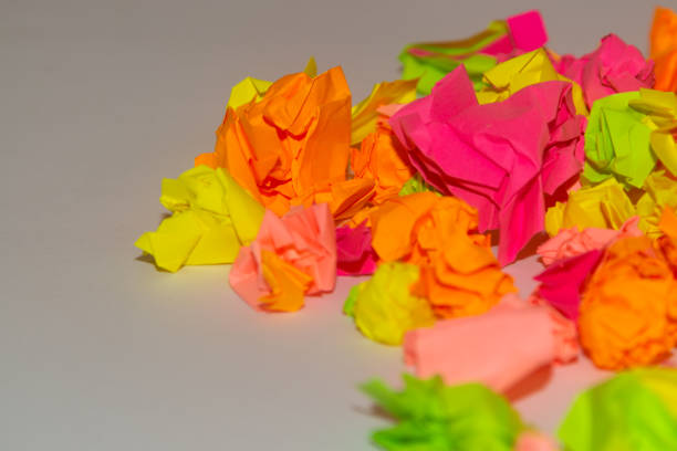istock Bright crumpled multi-colored stickers on the office white board. 1085046894