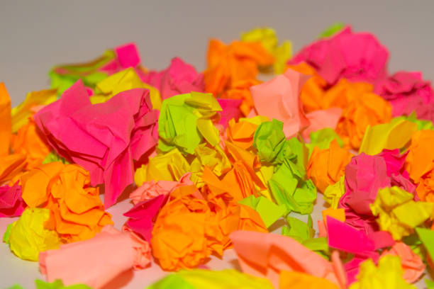 istock Bright crumpled multi-colored stickers on the office white board. 1085046902