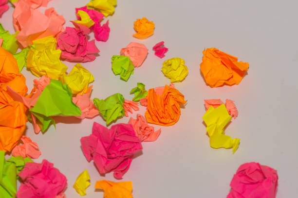 istock Bright crumpled multi-colored stickers on the office white board. 1085046910