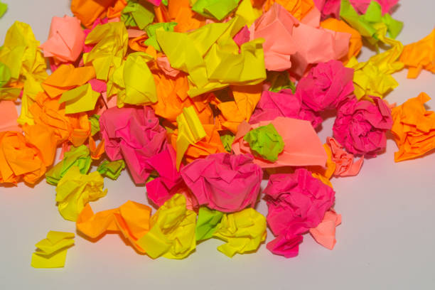 istock Bright crumpled multi-colored stickers on the office white board. 1085046924