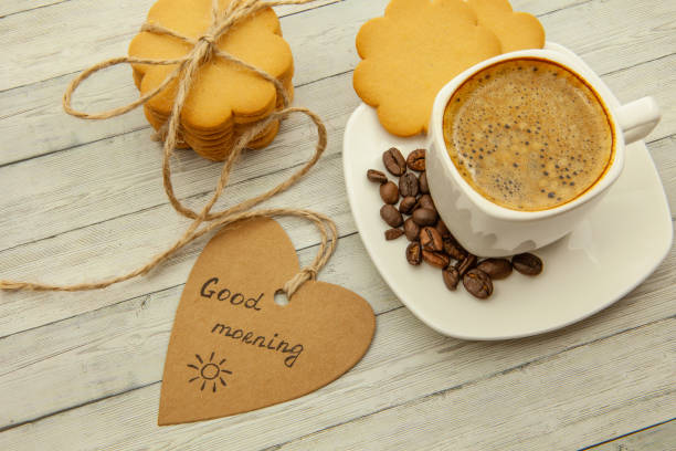 istock White cup with coffee, coffee beans and ginger biscuits, healthy breakfast concept 1085046926