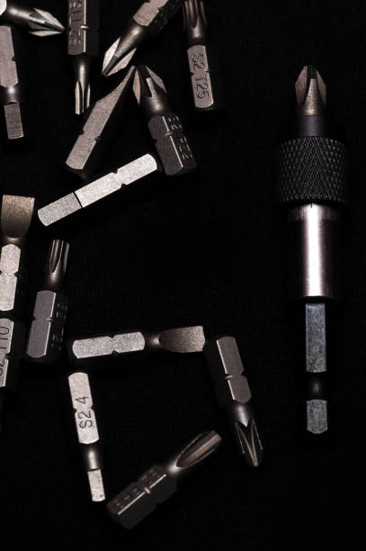 istock Tool carbon steel bits with bit holder on black background in dark key style. 1085047886