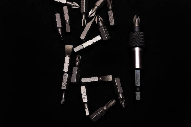 istock Tool carbon steel bits with bit holder on black background in dark key style. 1085047898