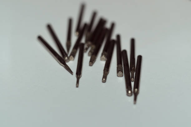 istock Diamond drill bits on white background. Close-up view. Tools jeweler and dentist. 1085047906