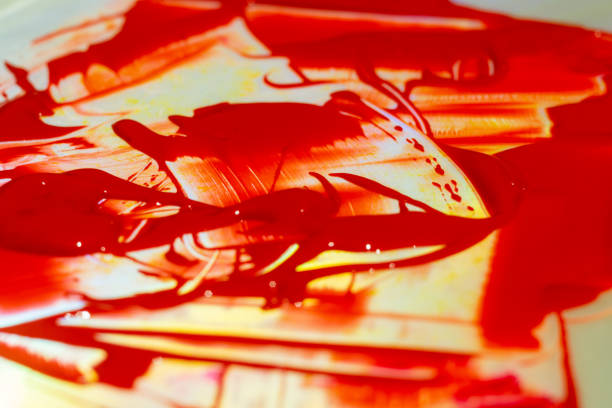 istock Hue red acrylic paint on glare table. Palette on table. Artist life. 1085048152