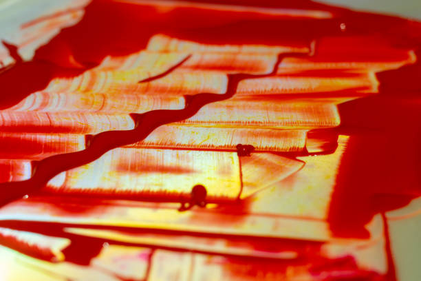 istock Hue red acrylic paint on glare table. Palette on table. Artist life. 1085048162