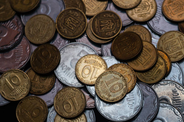 istock Small Ukrainian coins isolated on black background. Close-up view. 1085048580