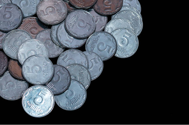 istock Small Ukrainian coins isolated on black background. Close-up view. 1085048584