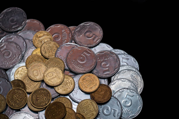 istock Small Ukrainian coins isolated on black background. Close-up view. 1085048618