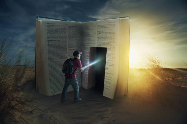 Door in Bible A man discovers a door inside a Bible. pursuit concept stock pictures, royalty-free photos & images
