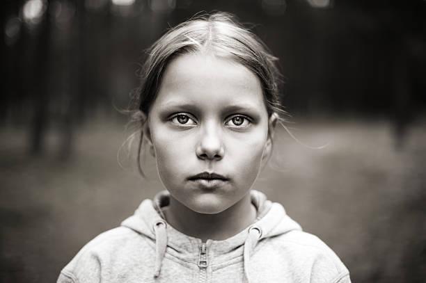 Black and white portrait of tired little girl stock photo