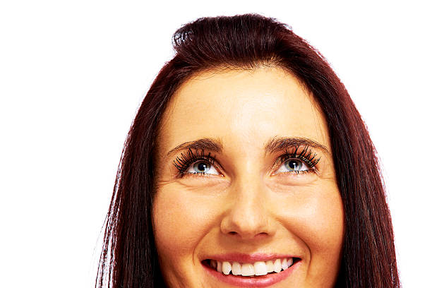 istock attractive female looking above her head over white 108506996