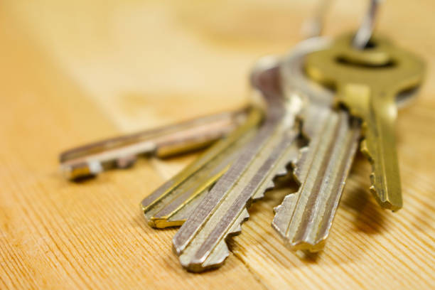 istock a bunch of keys on a wooden table 1085076470
