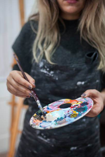 istock Female artist working in studio 1085079274
