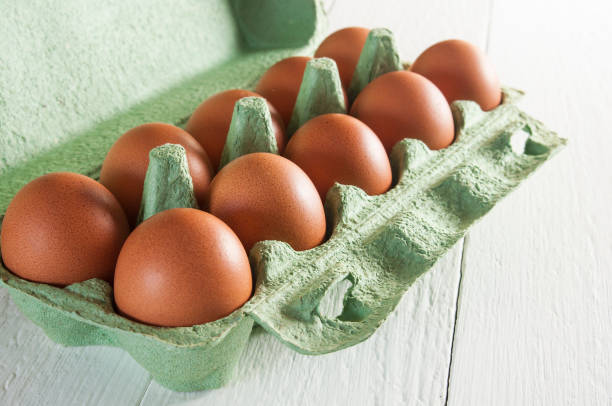 istock Large brown chicken eggs in carton packaging. 1085079894
