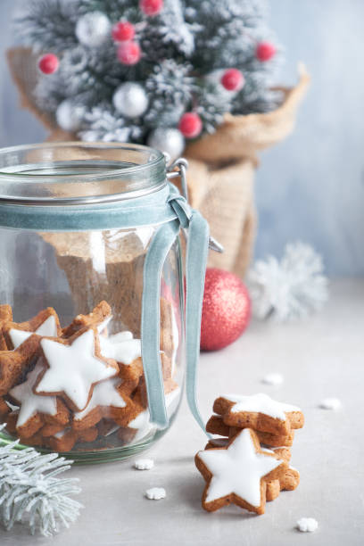 istock Star ginger cookies in a glass jar and decorated  Xmas tree 1085094780